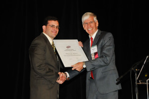 ECS President Paul Kohl presented one of the Society's esteemed awards at the 2014 ECS and SMEQ Joint International Meeting.