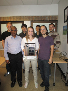 The 2014 Outstanding Student Chapter Award Plaque with Prof. Arumugam Manthiram (front left) and UT-Austin Student Chapter Members.