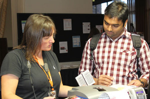 Dinia, who is ECS's graphic designer, helping register attendees at the 228th ECS Meeting