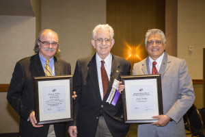 Adam Heller (center) receiving the ECS Lecture plaque from ECS President Daniel Scherson (left) and Honorary Member Plaque from ECS Vice President Krishnan Rajeshwar (right).